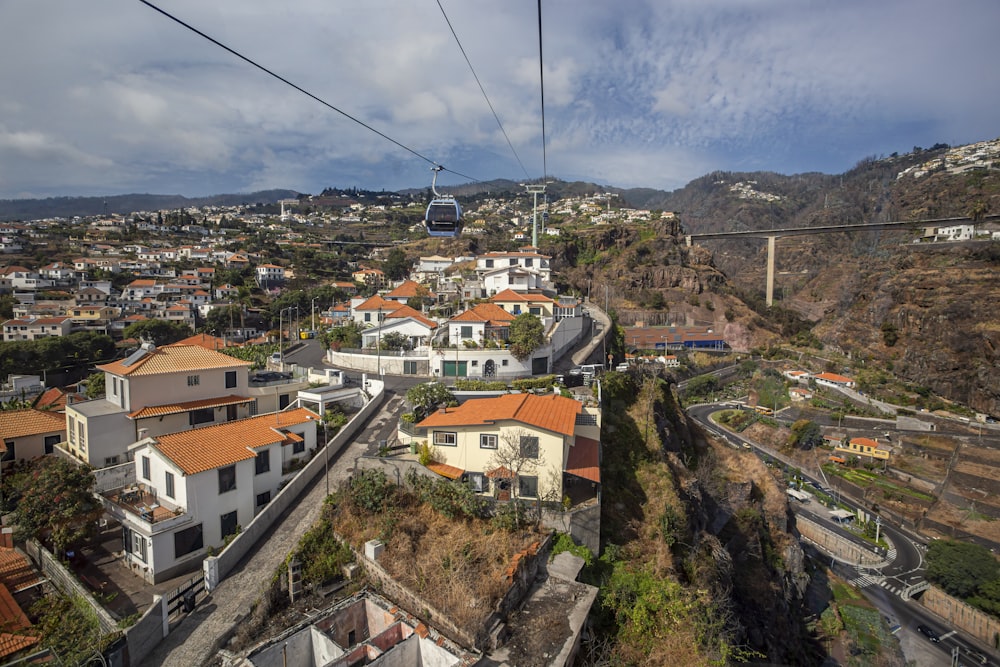 a cable car going over a small town