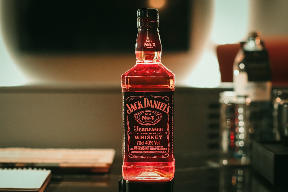 a bottle of jack daniels whiskey sitting on a table