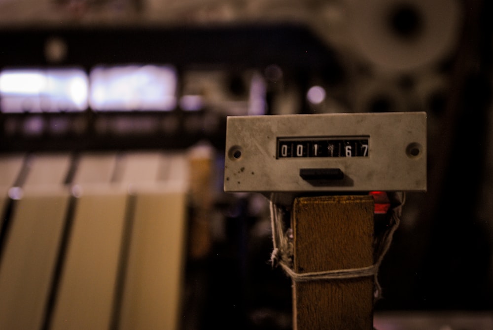 a close up of a machine that is working on a piece of wood