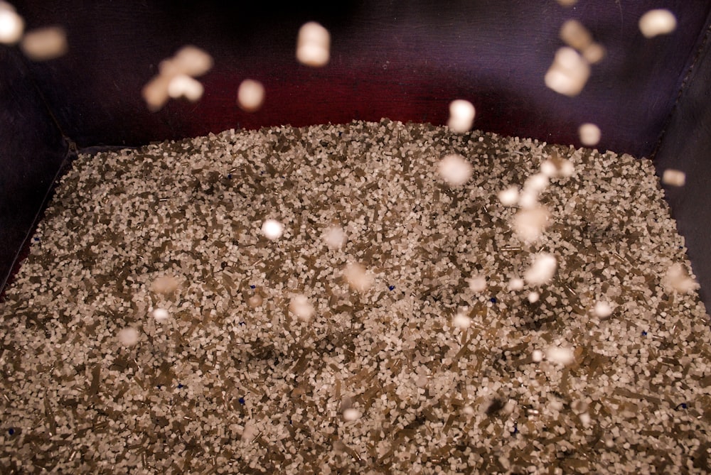 a pile of dirt sitting inside of a metal container