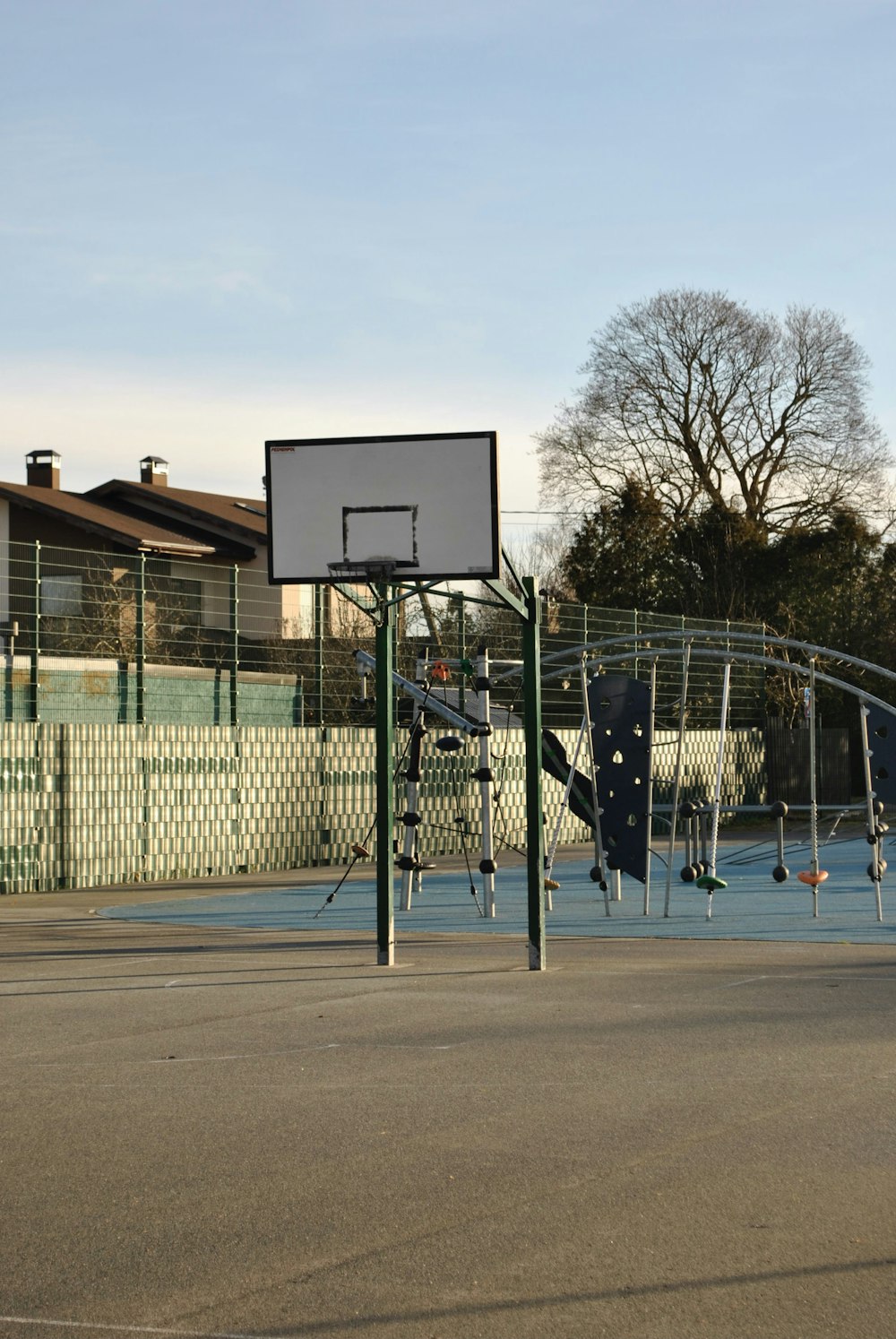 a basketball court with a basketball hoop in the middle of it