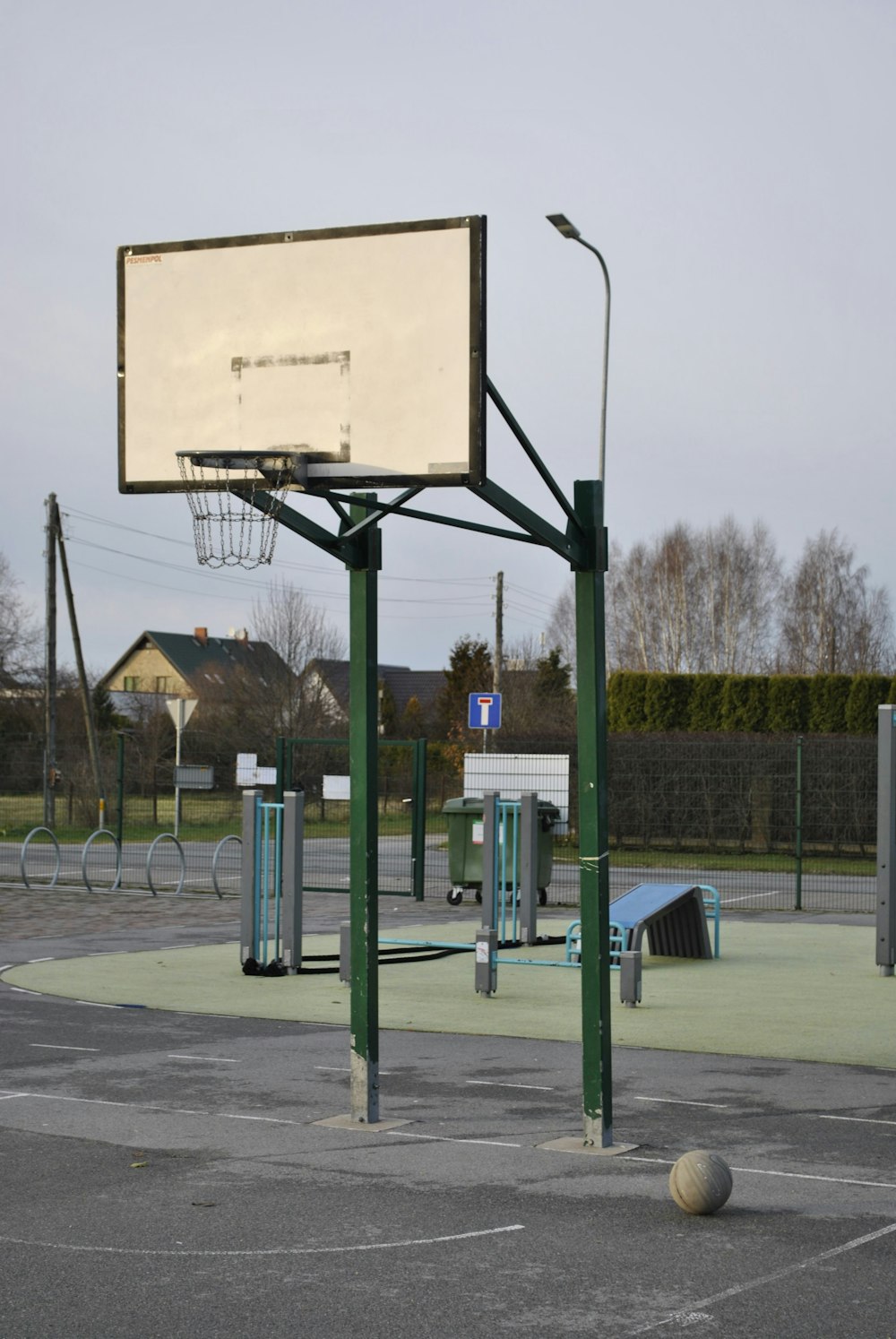 a basketball court with a basketball in the middle of it