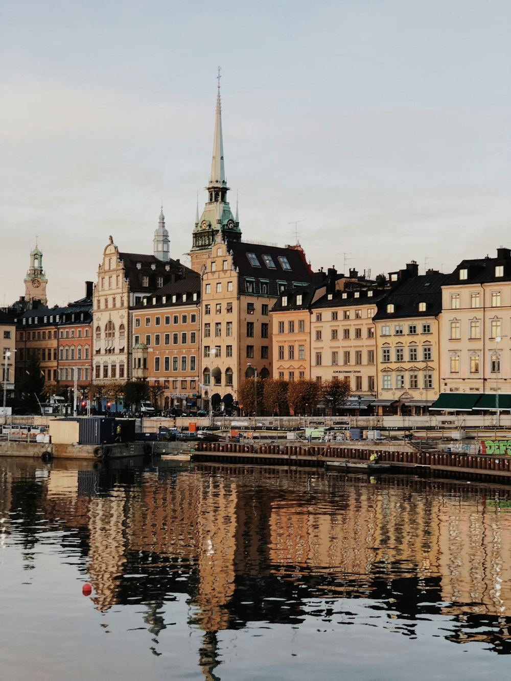 a body of water with buildings in the background