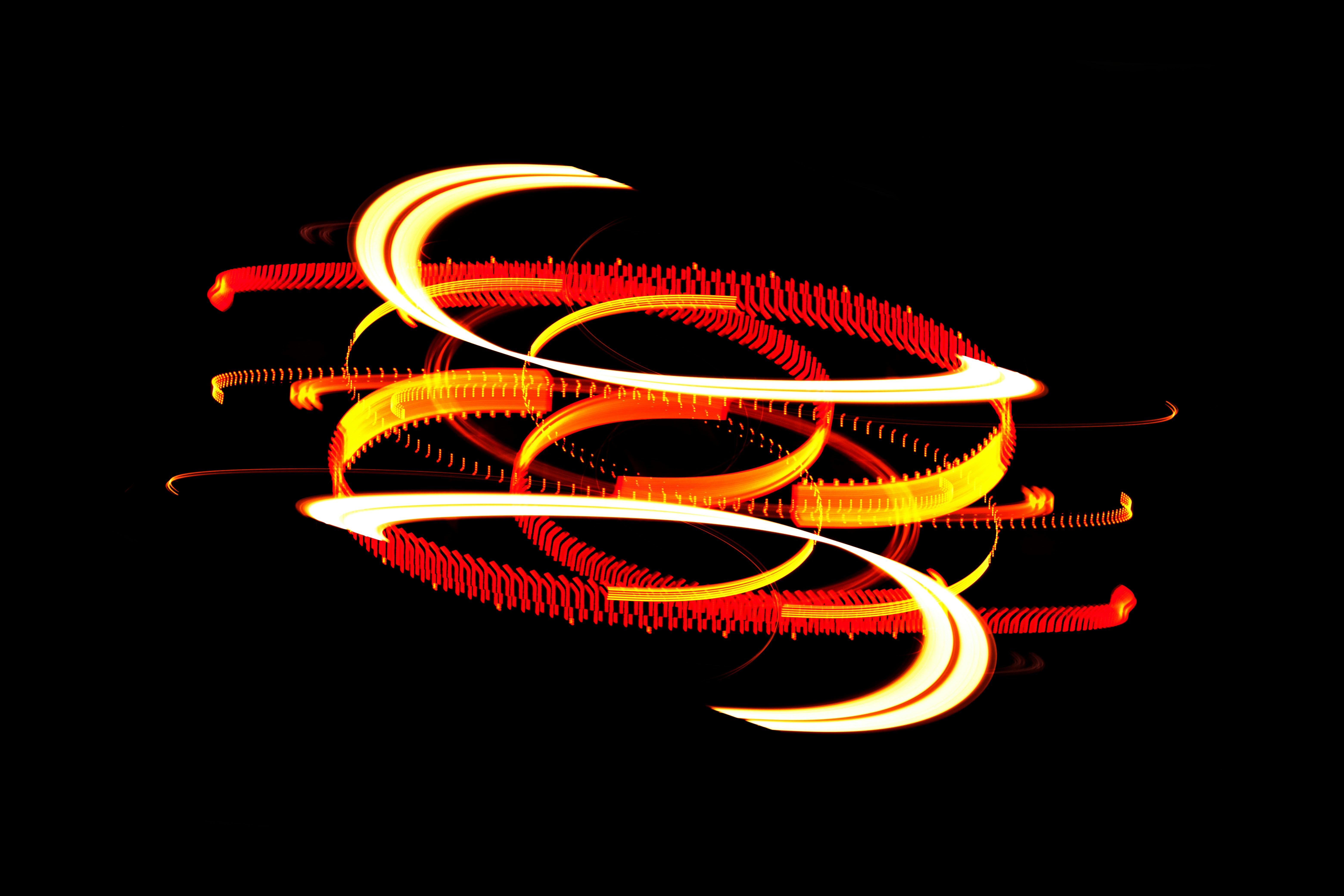 a black background with red and yellow swirls