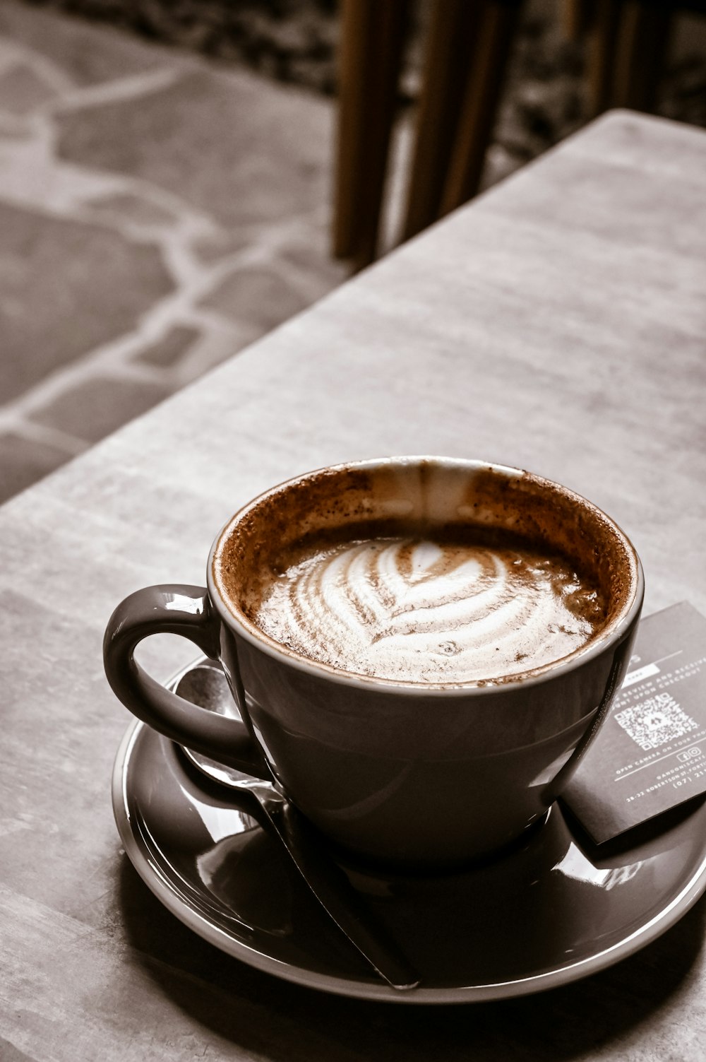 a cup of coffee sitting on top of a saucer