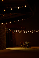 Outdoor seating area with comfortable chairs and soft lighting for relaxing evenings