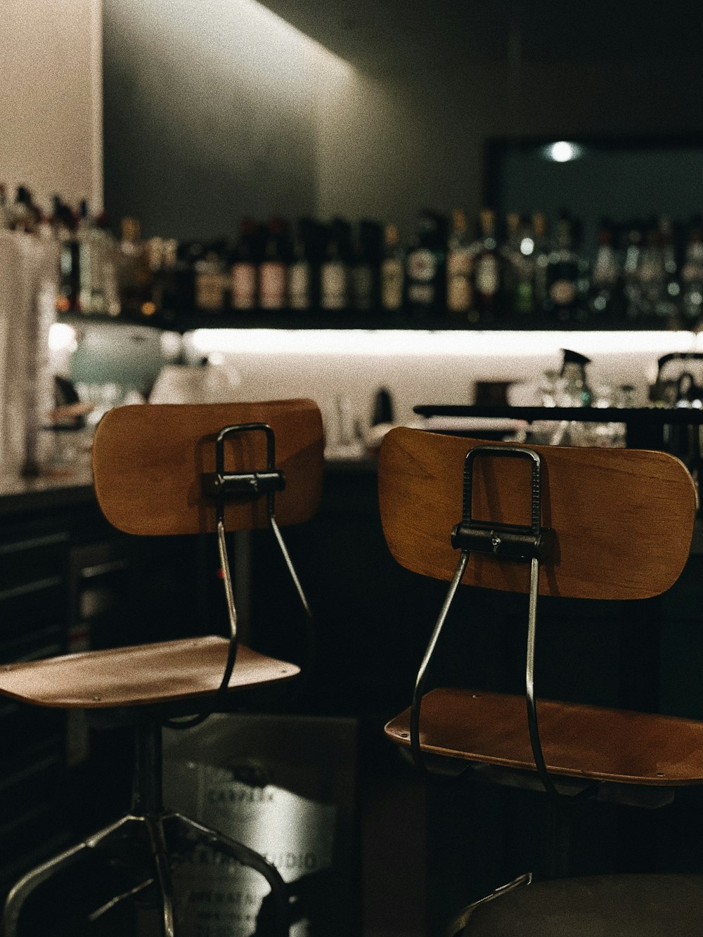 a couple of wooden chairs sitting next to each other