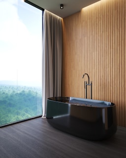 a large bath tub sitting next to a window