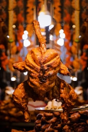 a close up of a chicken on a plate