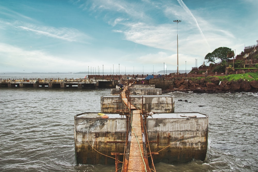 a long wooden bridge over a body of water