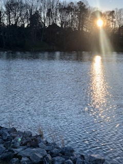 A serene view of the Bio Bio riverbank with mining equipment quietly resting nearby at sunset.