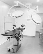 a black and white photo of a hospital room