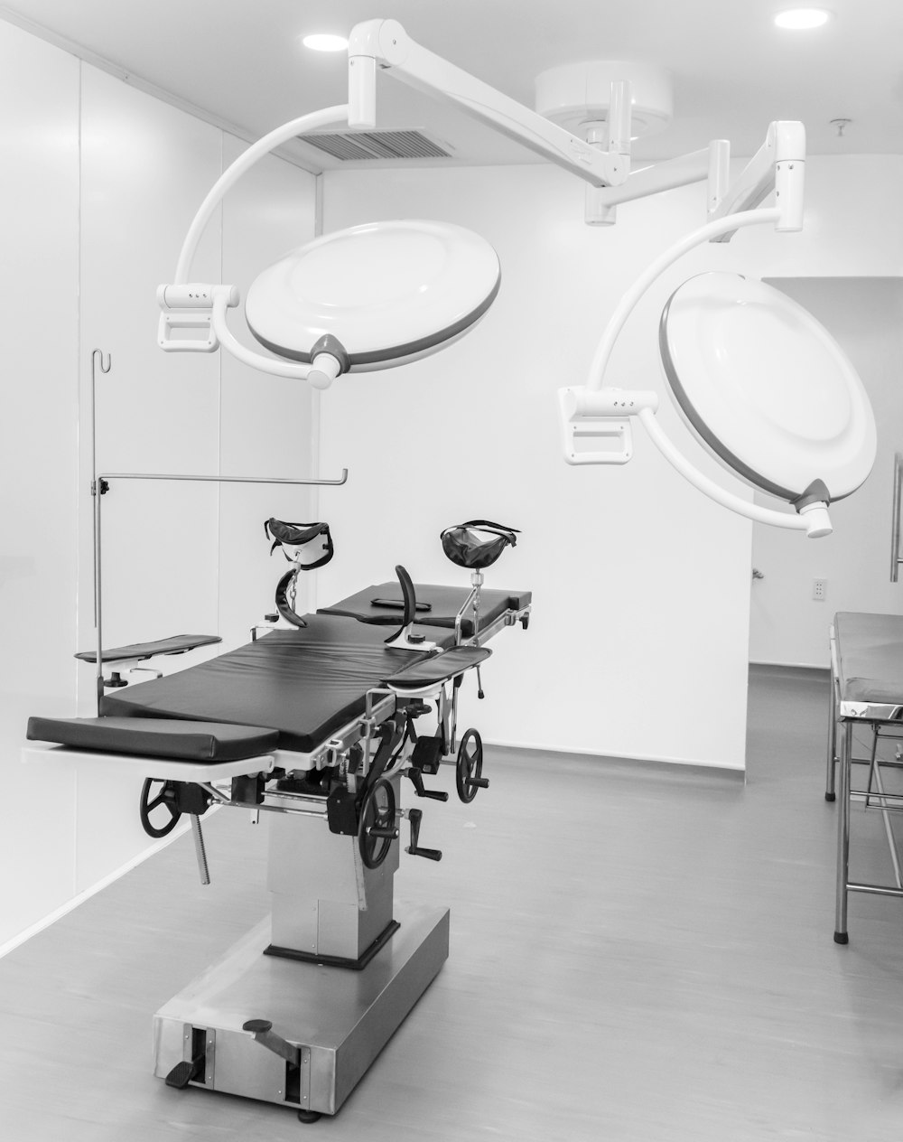 a black and white photo of a hospital room