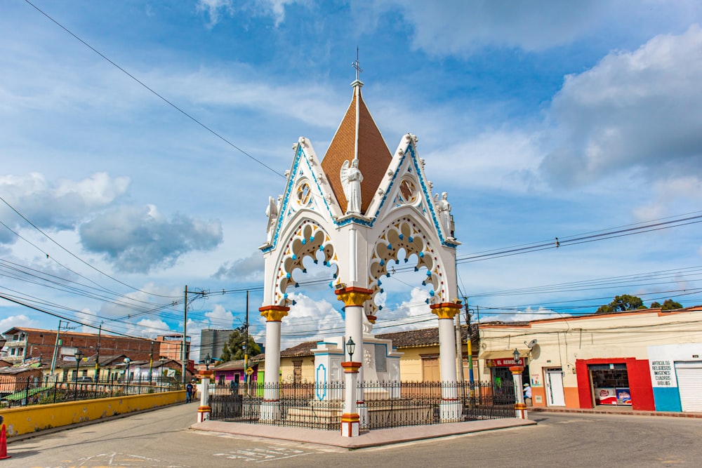 a clock tower in the middle of a street