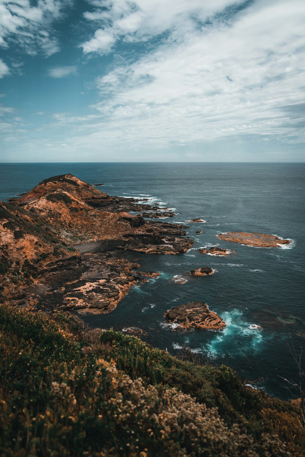 a view of the ocean from a cliff