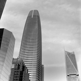 a black and white photo of some very tall buildings