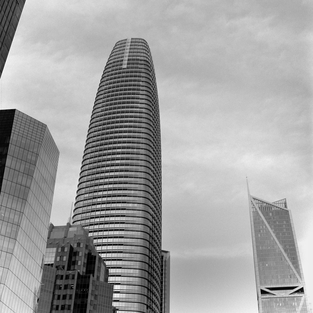 a black and white photo of some very tall buildings