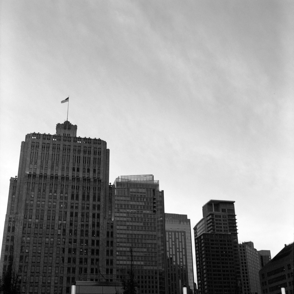 a black and white photo of a city with tall buildings