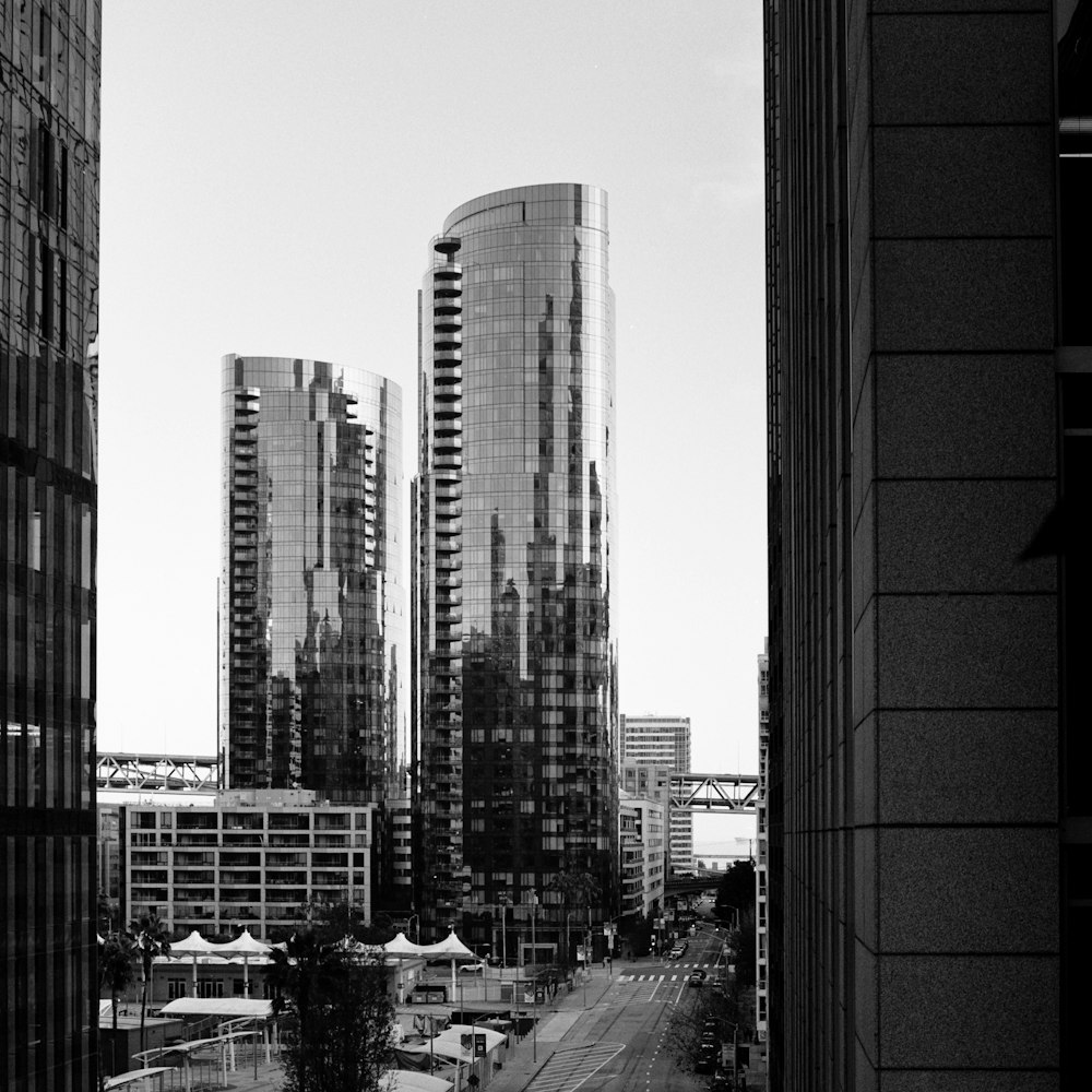 a black and white photo of a city with tall buildings