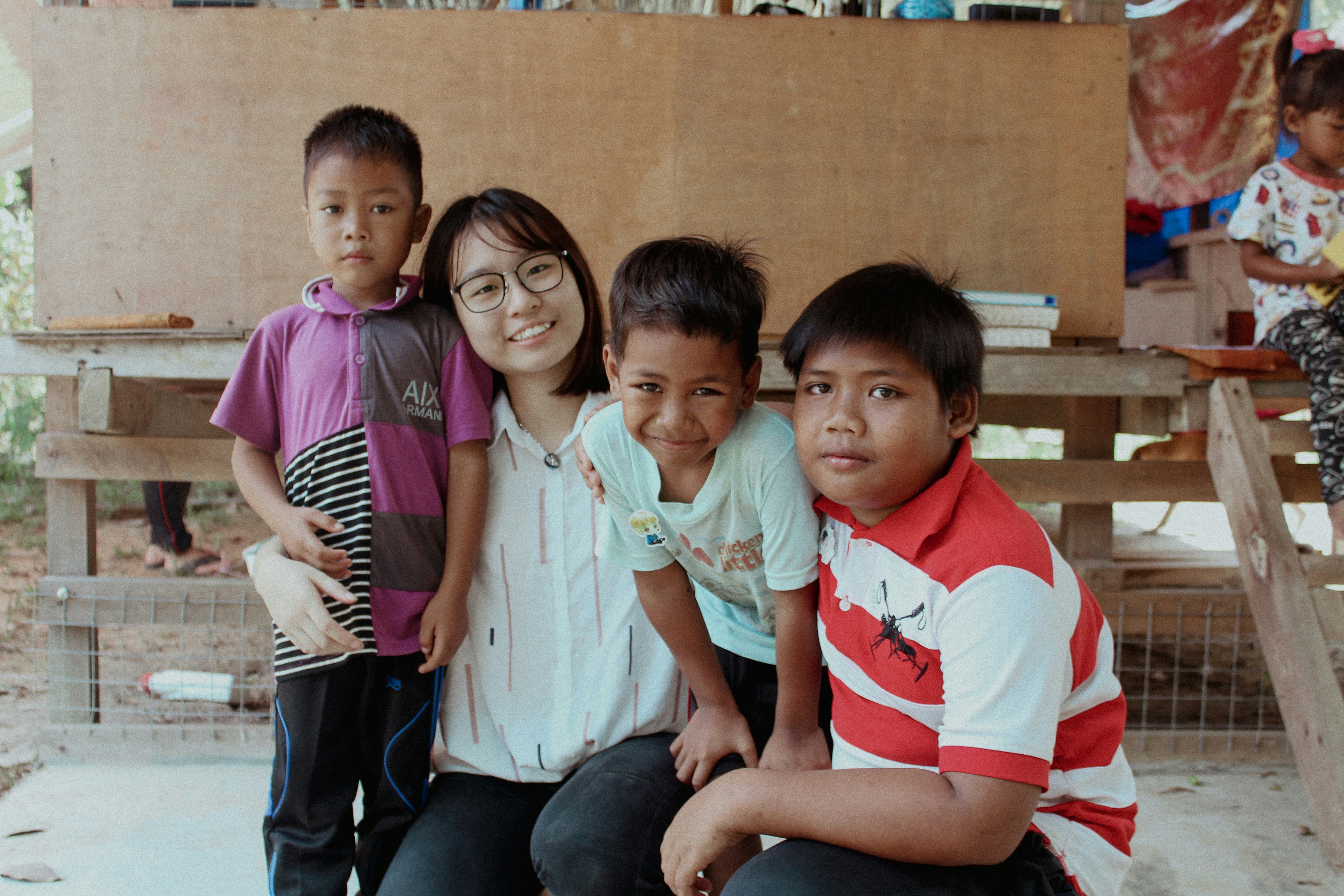 a group of young children standing next to each other