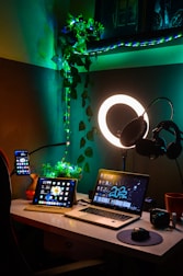a laptop computer sitting on top of a wooden desk
