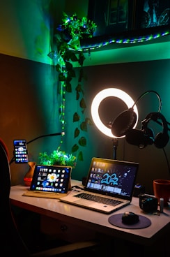 a laptop computer sitting on top of a wooden desk