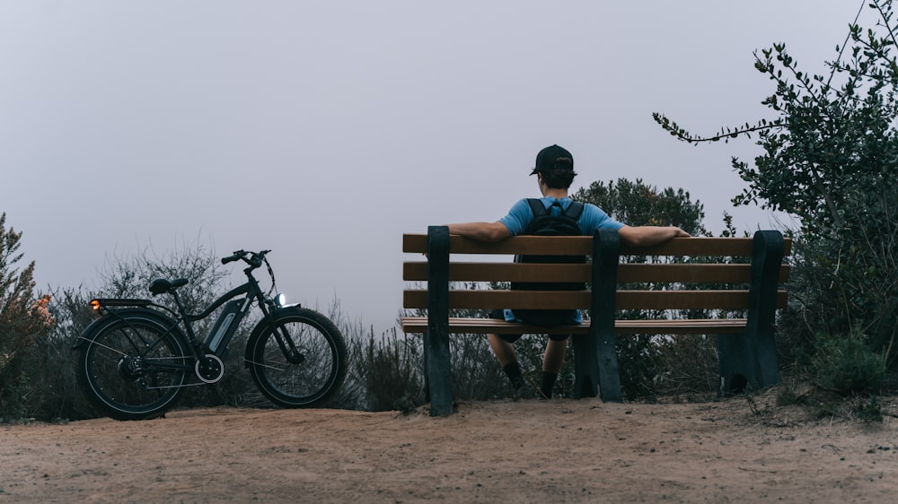 a man sitting on a park bench