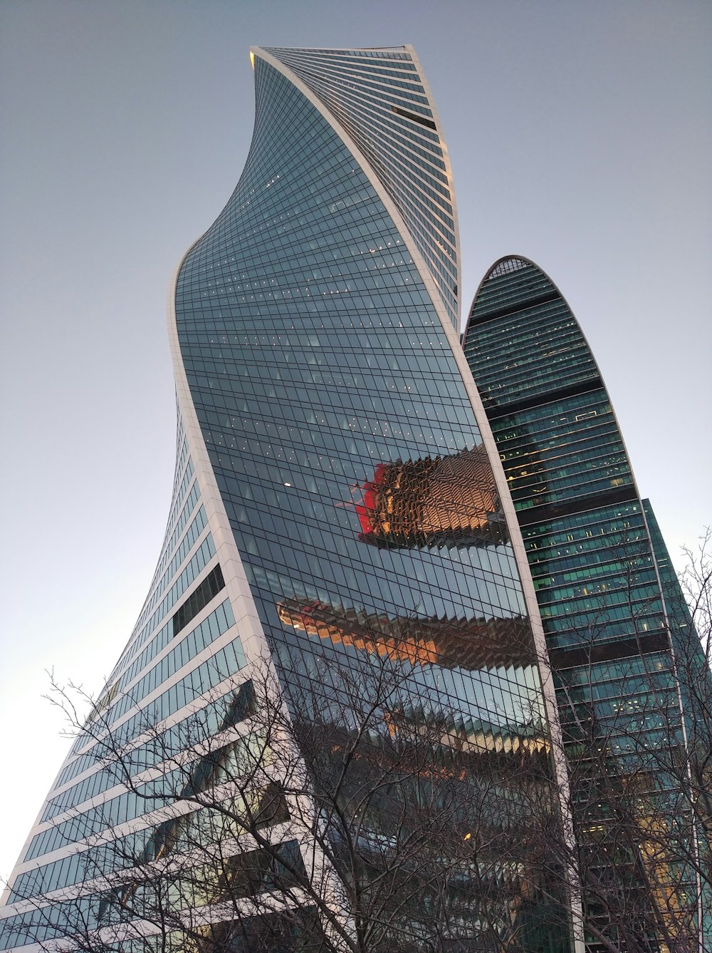 a very tall building with a very curved roof
