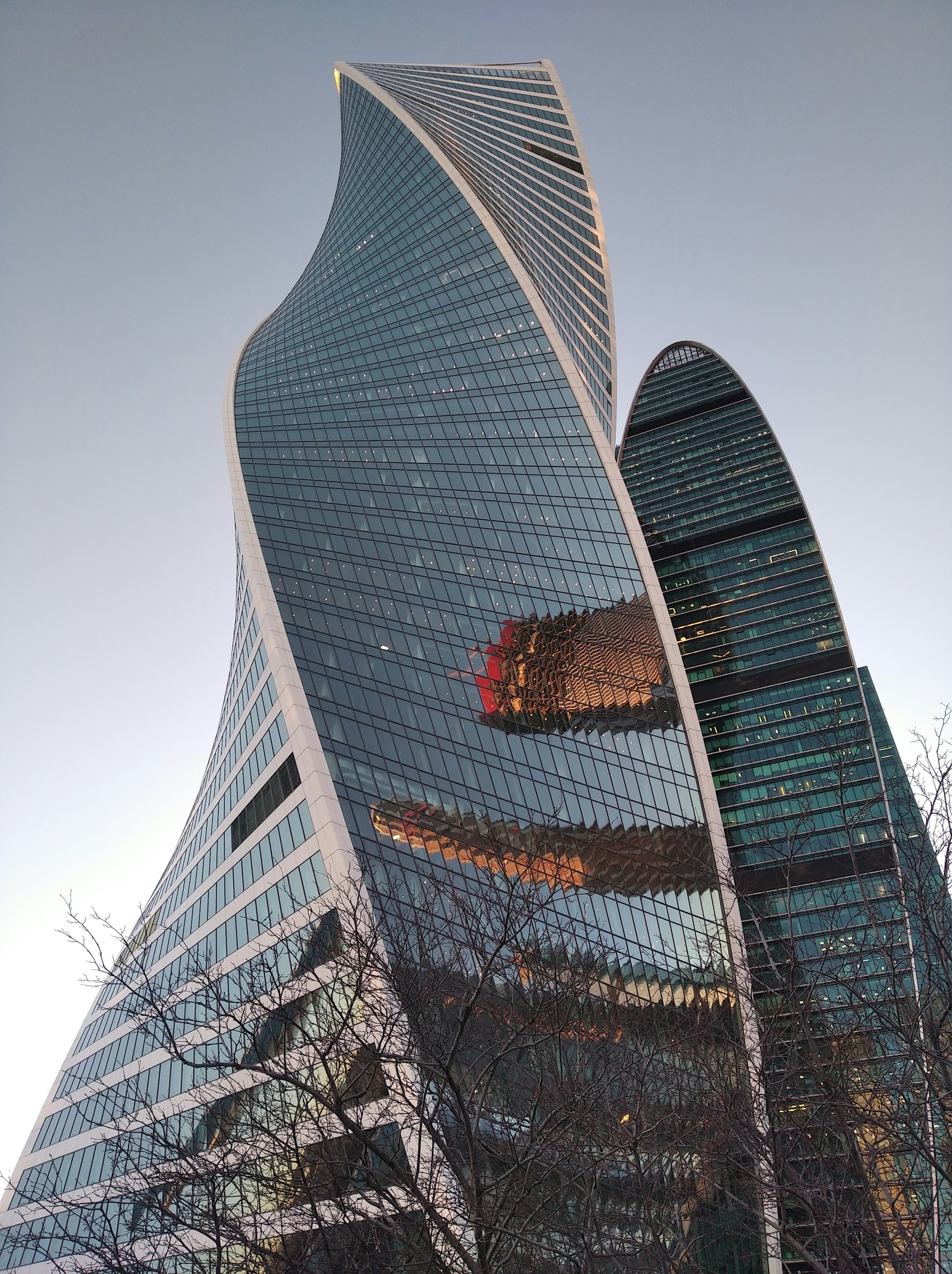 a very tall building with a very curved roof