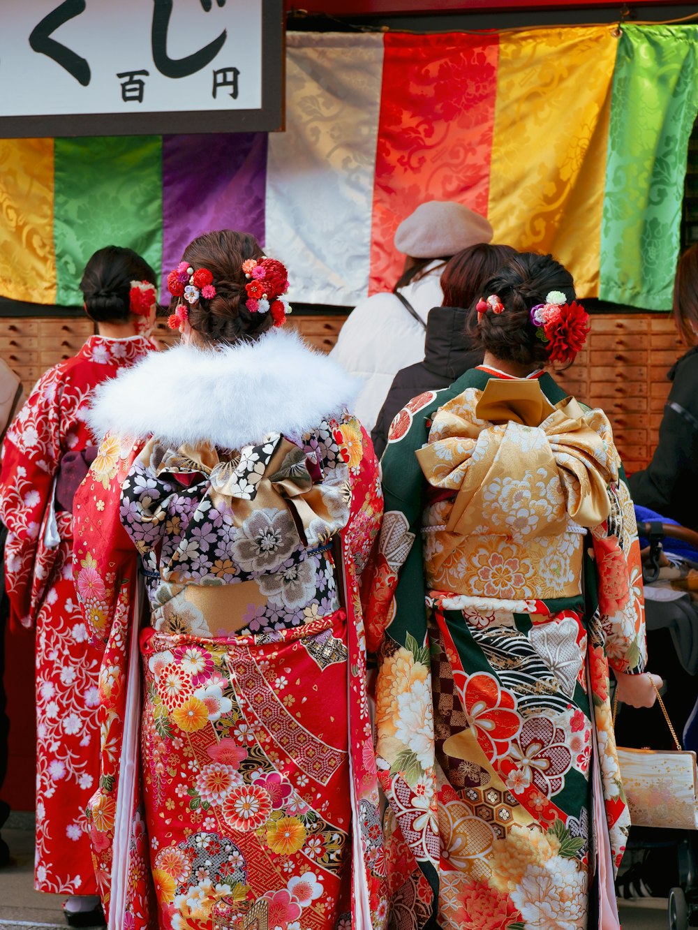 a couple of women walking down a street next to each other