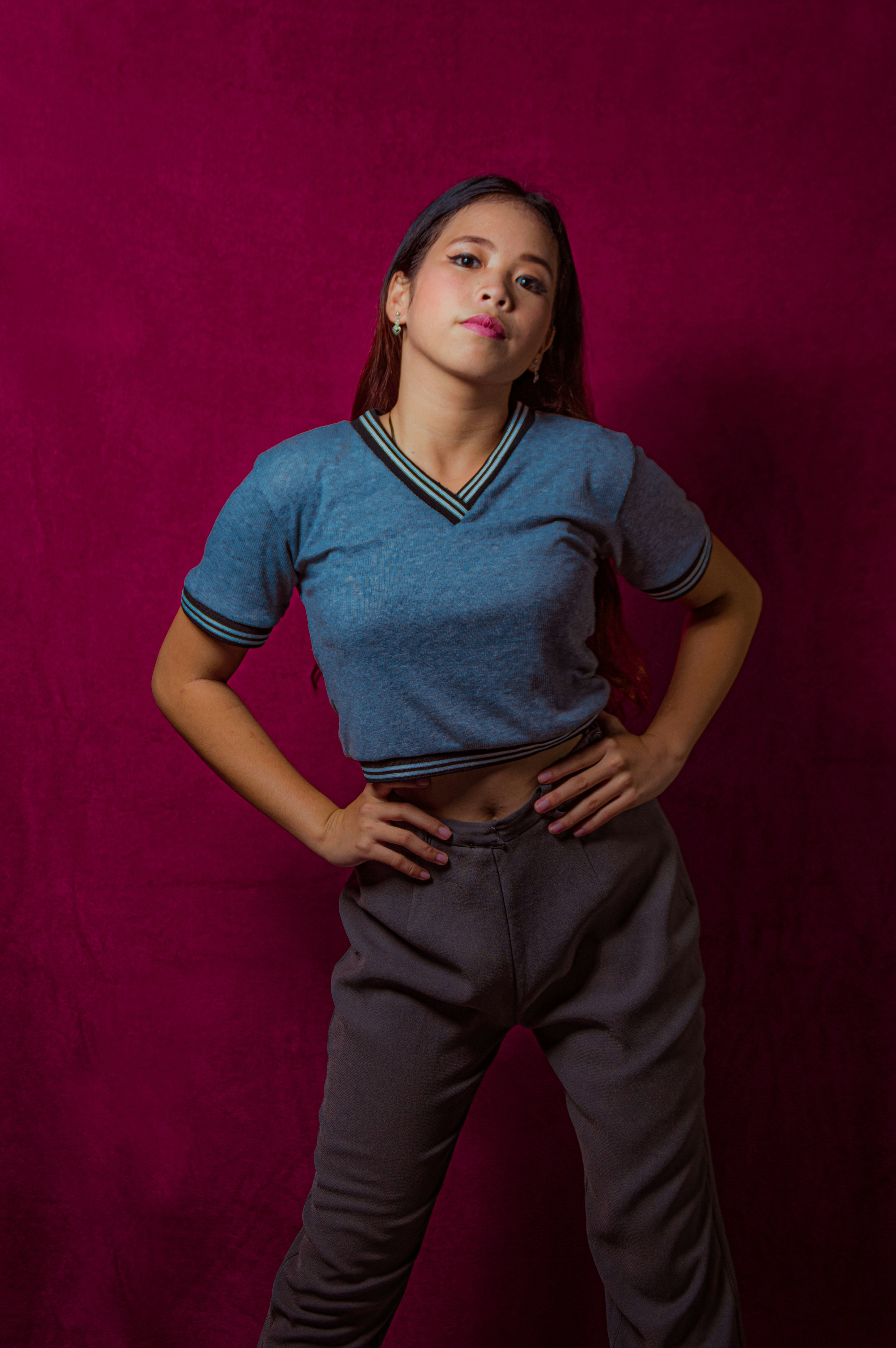 a woman posing with her hands on her hips