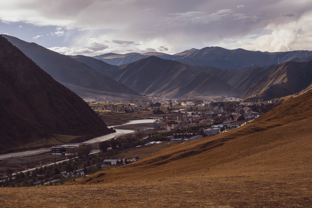 a view of a valley with a river running through it