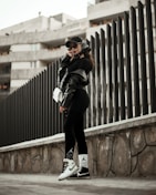 A model showcasing a full outfit blending comfort and standout design in an urban setting.