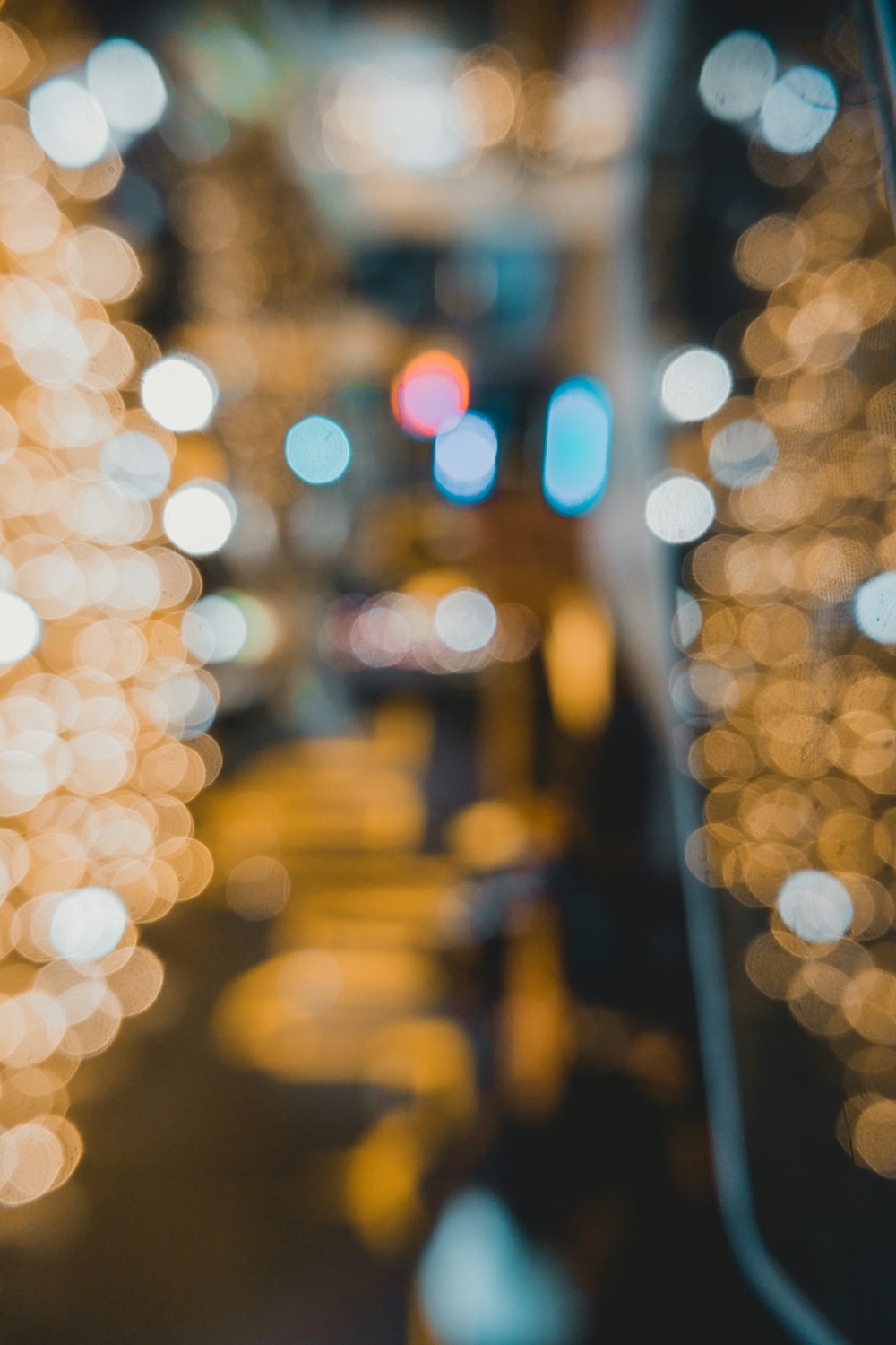 a blurry photo of a city street at night