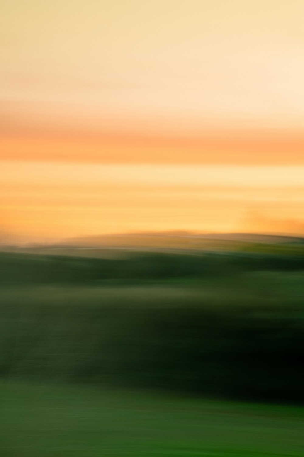 a blurry photo of a plane flying in the sky