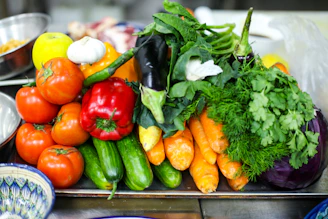 A client enjoying a nutrition education session with colorful fresh vegetables in the background.