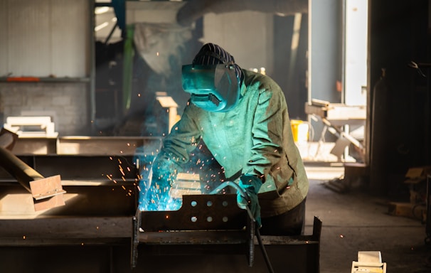 a welder working on a piece of metal