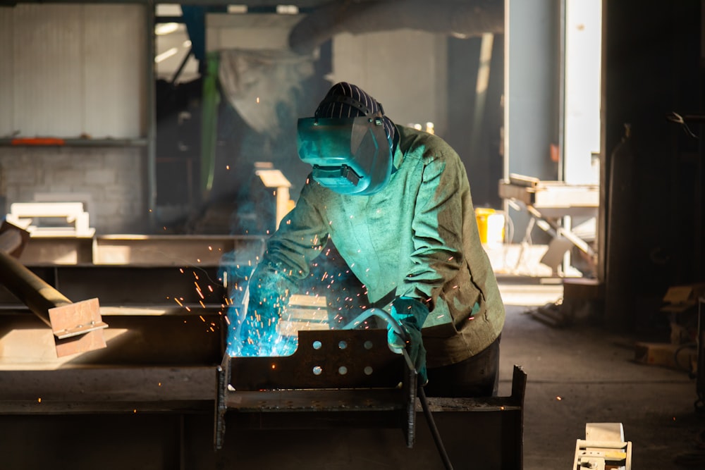 a welder working on a piece of metal