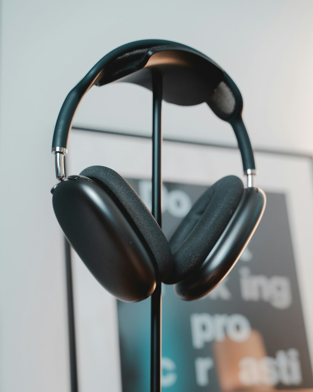 a pair of black headphones on a stand