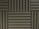 Various panels with a grooved pattern arranged in a symmetrical manner. The panels have a textured surface and appear to be made of foam material, commonly used for soundproofing.