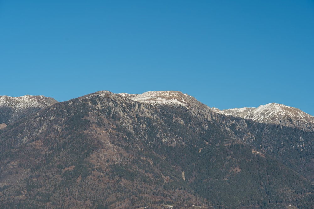 a view of a mountain range with snow on the top