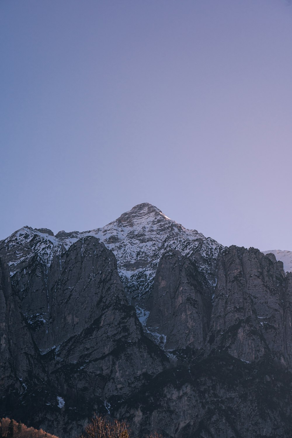 a mountain with a snow covered peak in the distance