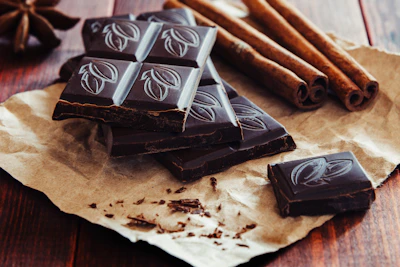 Blocks of cacao with panela sugar, arranged on a rustic wooden table.