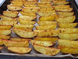 a pan filled with cooked potatoes on top of a table