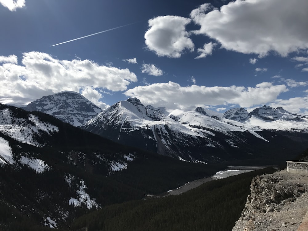 a view of a mountain range with snow on the mountains