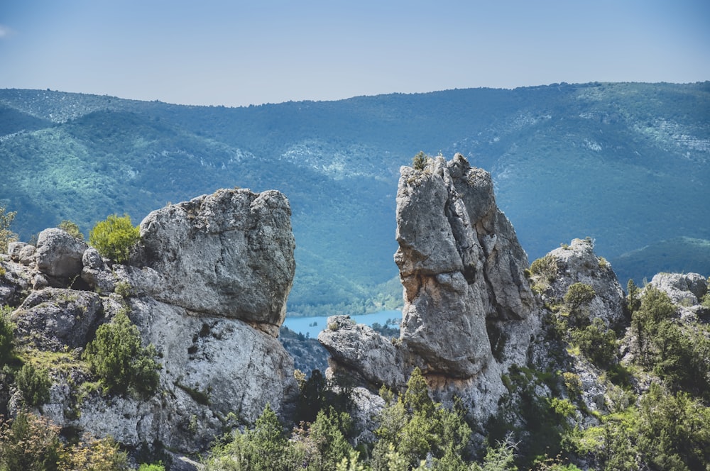 a view of a mountain range with a lake in the distance