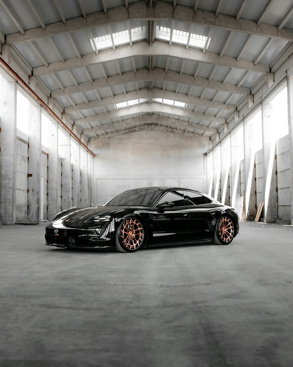 a black sports car parked in a garage