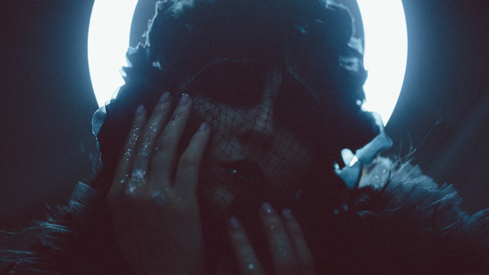 a woman covering her face with her hands