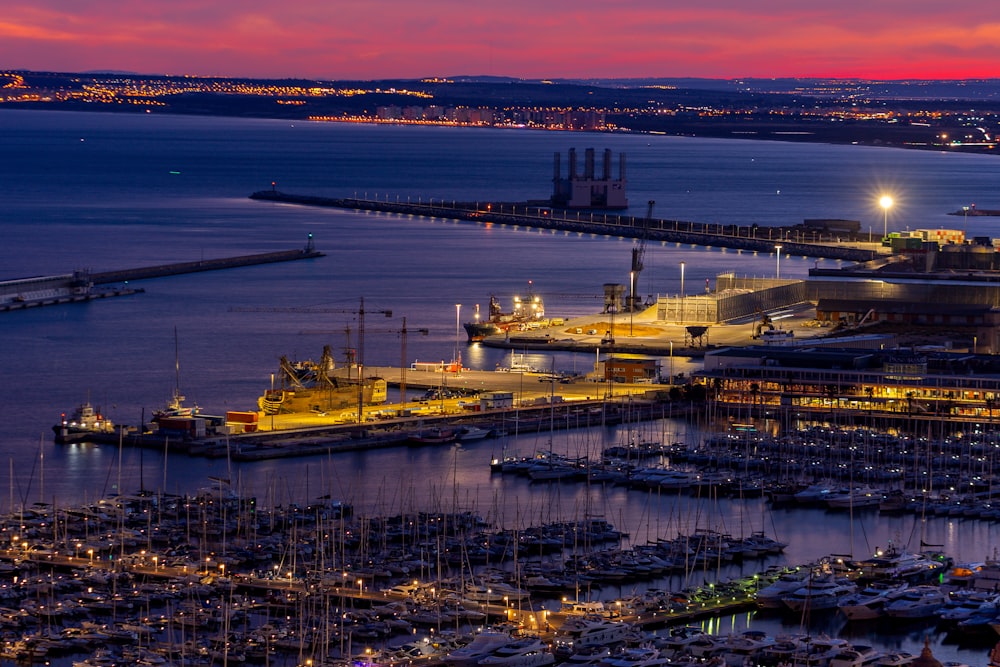 a harbor filled with lots of boats at night