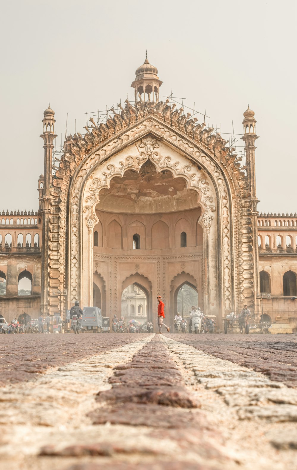 a person standing in front of a large building